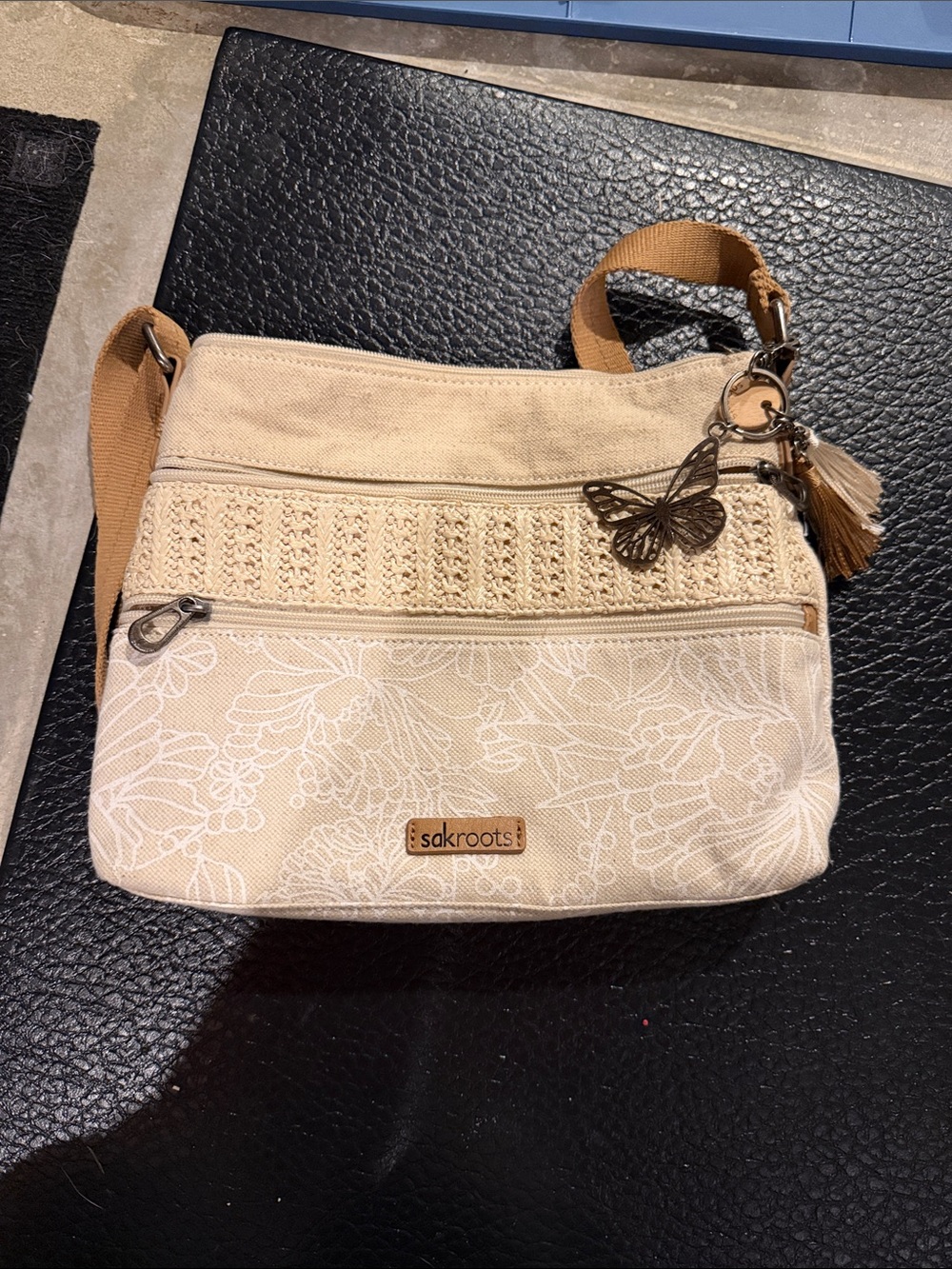 Sakroots Beige Floral Crossbody Bag with Butterfly Tassel